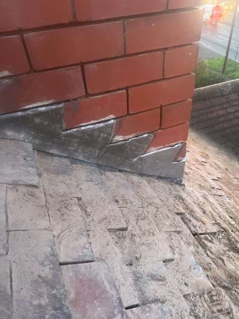 This is a photo of new leadwork being installed around an old chimney. Works carried out by Waterlooville Roofing Repairs